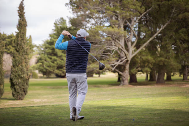 istock Adult man playing golf in autumn 1569853407