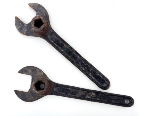Close up of two old spanners isolated on white.