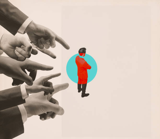 istock Many hands pointing at one businessman 1569872647