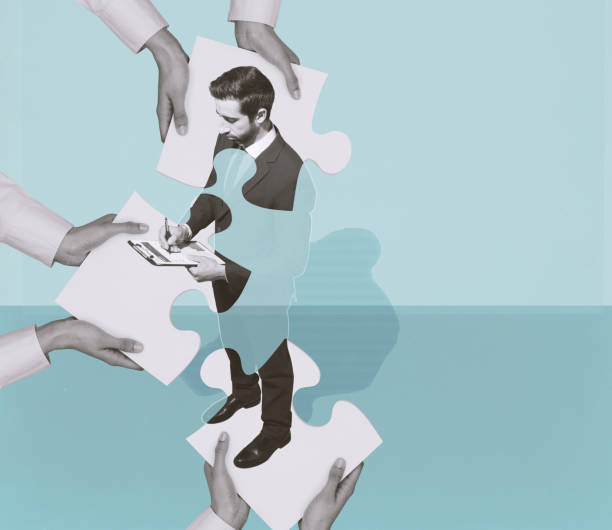 Hands joining puzzle pieces and forming a business executive