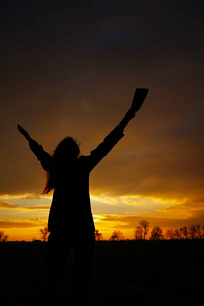 istock Woman staying with raised hands 156989541