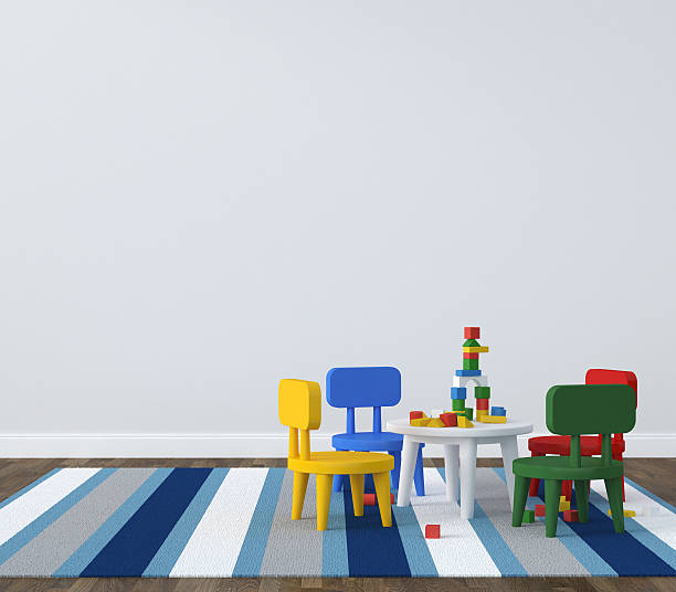 Childs play table on a striped rug in a simple room