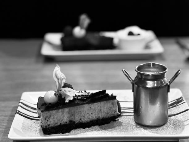 istock Cheesecake dessert with a side of fresh cream 1569910494