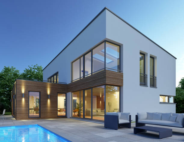 istock Modern cubic house with pool in the evening 1569911790