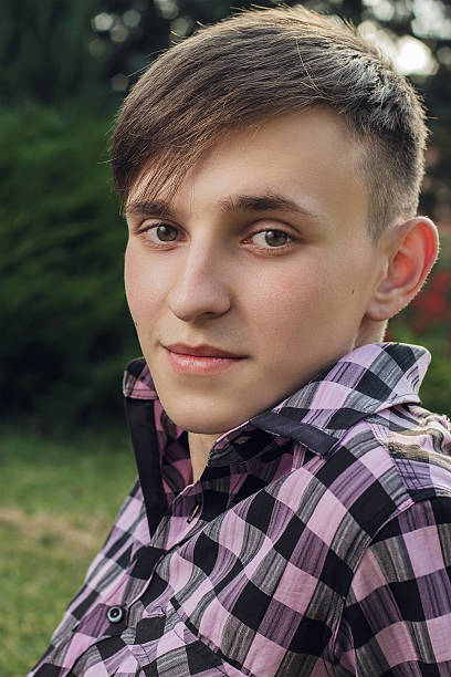 istock portrait of young handsome man in park 156992563