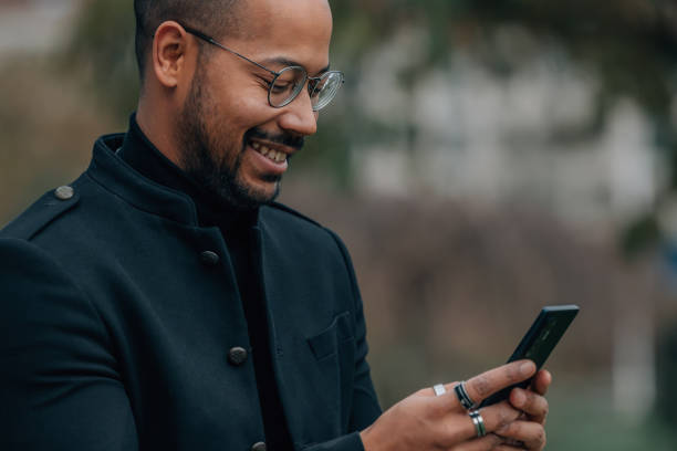 istock man with mobile or cell phone in the street 1569951844