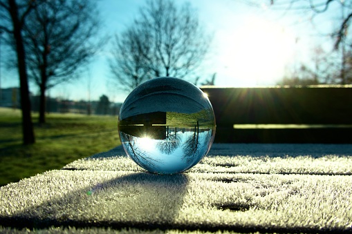 Crystal ball on frozen table at park