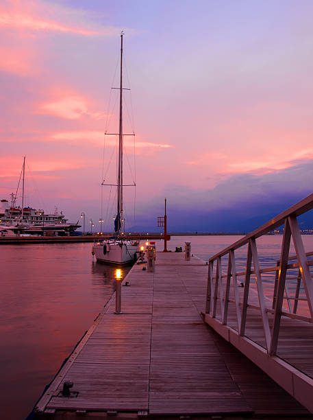 Cloudy sky at sunset in the port stock photo