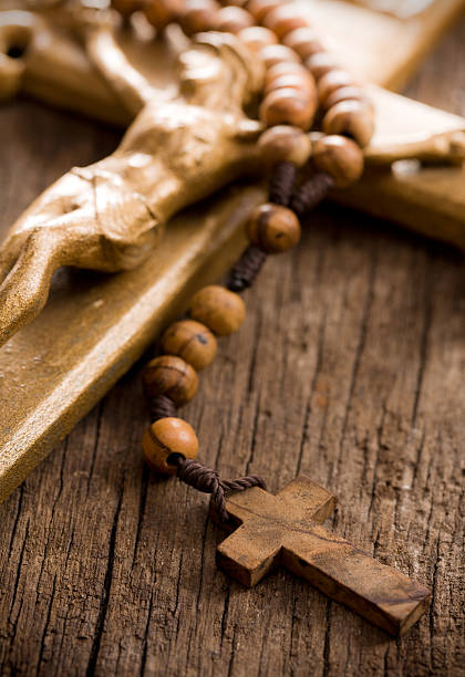 istock Wooden rosary beads and crucifix 156998702
