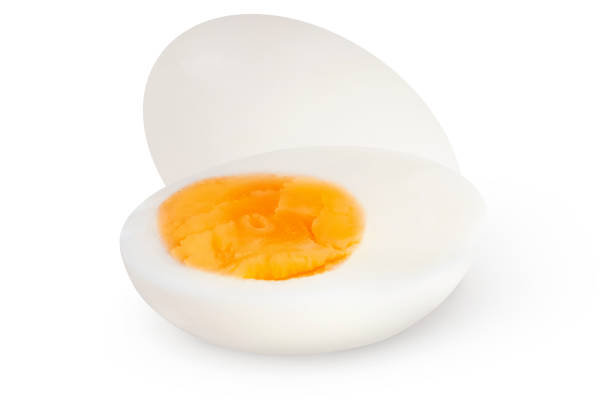 istock Whole and cut eggs on an isolated white background. 1569989769