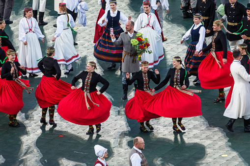 Riga, Latvia - July 8, 2023: Dancers take photos before performing at a concert in Daugava Stadium