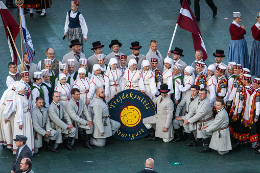 Riga, Latvia - July 8, 2023: Dancers take photos before performing at a concert in Daugava Stadium