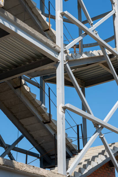 istock Construction of a building using scaffolding. Facade restoration work. Fragment of scaffolding and stairs 1570013512