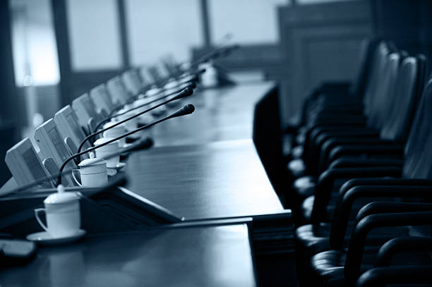boardroom boardroom with chairs and intercom system summit meeting photos stock pictures, royalty-free photos & images