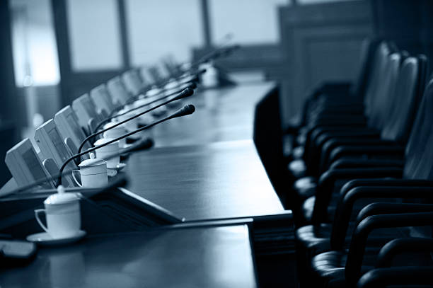 boardroom boardroom with chairs and intercom system shareholders meeting stock pictures, royalty-free photos & images