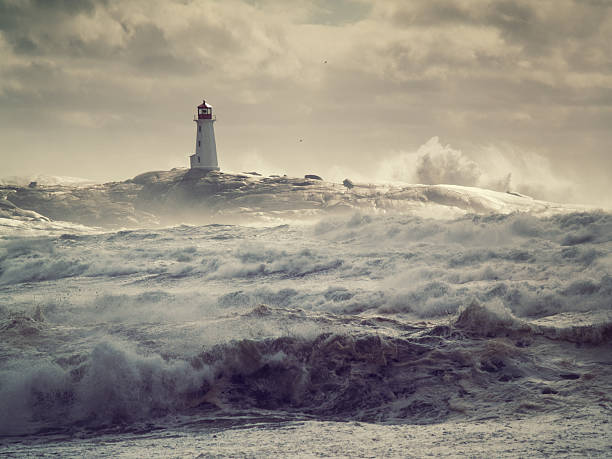 Rough Seas Hurricane surf crashes on the rocks at Peggy's Cove high tide stock pictures, royalty-free photos & images