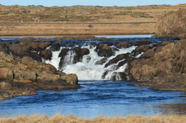 istock Waterfall Over Volcanic Rock in Remote Iceland 1570022070