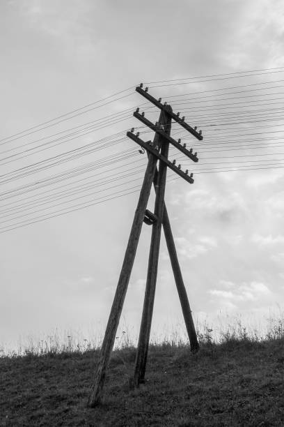 istock power line poles on black and white background 1570023202