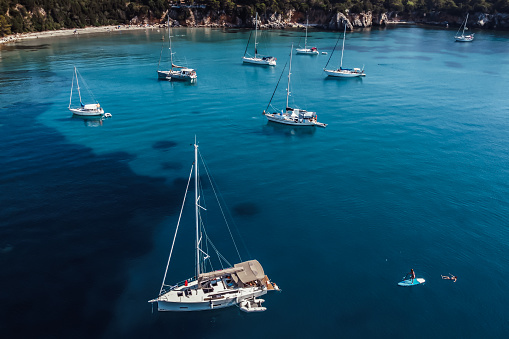 Group of sailboats moored at a beautiful bay in Greece.