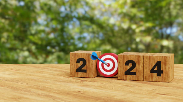 istock 2024 Year wooden cubes with dart and target icon. Goal, Target, Resolution, strategy, plan, Action, mission, motivation, and New Year start concept. 3d illustration 1570092453