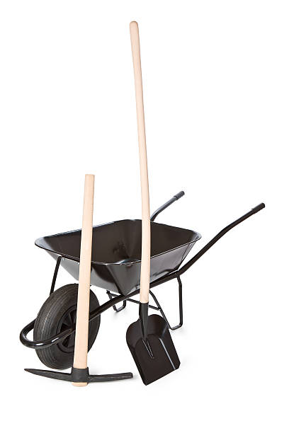 istock wheelbarrow with shovel and pick 157009419