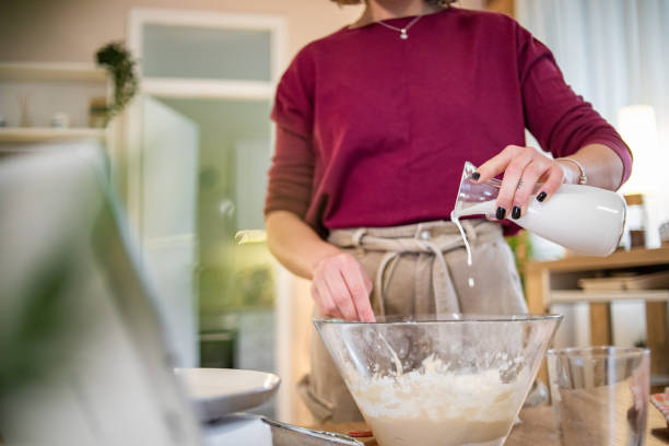 istock A young beautiful woman is preparing pancakes 1570096506
