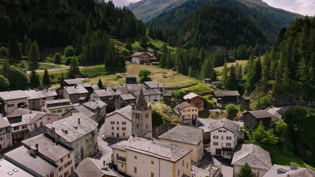 Drone Flight Over Rooftops in Swiss Mountain Village