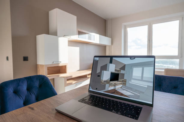 istock Laptop on the kitchen table with sketch 3d model of this apartment on the screen 1570124770