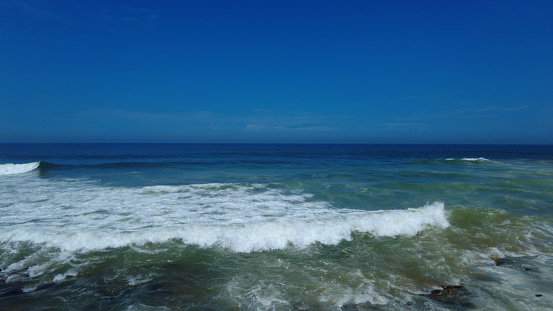 Kerala coastline, Arabian sea, bright blue sky, seascape view