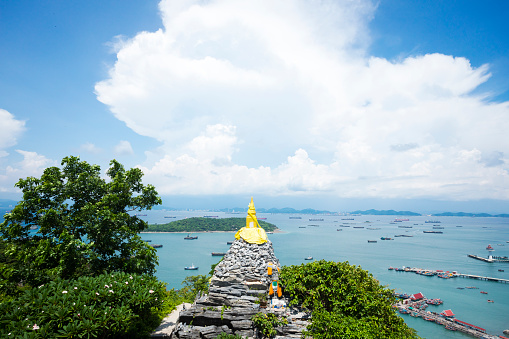 Panorama view of Gulf of Thailand from mountain and Mondop Roi Phraphutthabat Buddha Footprint temple on island Ko Sichang in Chonburi province. Temple is in north of island