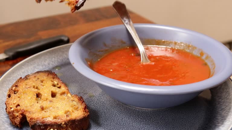 Man Guy Dipping Bread Toast into Red Tomato Soup