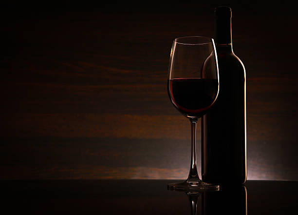 Bottle with red wine on the table stock photo