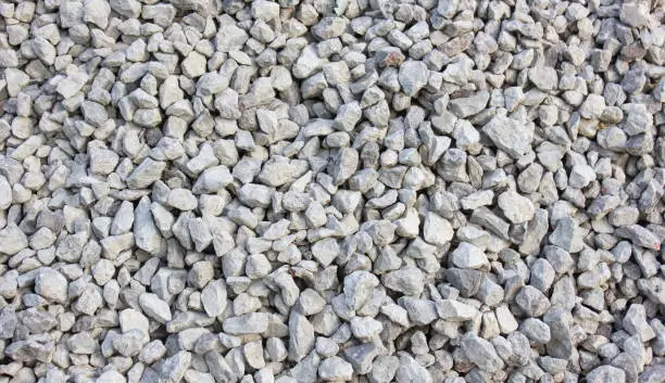 Crushed rocky, granite. Crushed stone construction. Middle fraction of stone building stone.Background, texture.