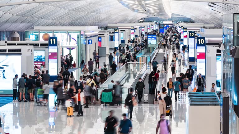 Time lapse of Asian tourist traveler people walk travelator at Hong Kong international airport terminal transit boarding gate. Oversea transportation, airline transport business, Asia travel lifestyle