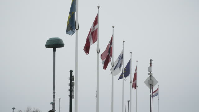 Scandinavian flags on a cloudy day