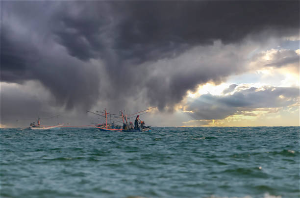 April 20 2023 Chumphon Thailand fishermen at sea in special fishing boats for shrimp and octopus, prepare for the storm.