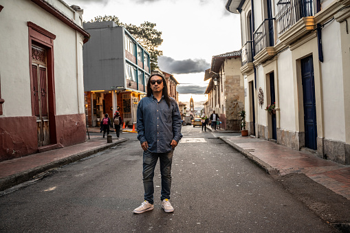Portrait of a mature asian man in historic district of Bogota, Colombia