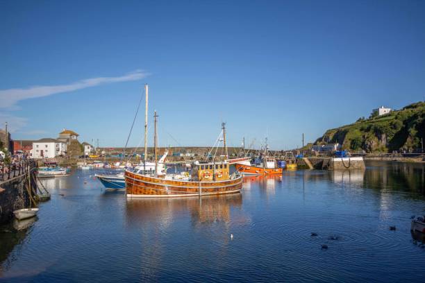 istock Boats in Mevagissey Harbour, Cornwall, UK 1570281150