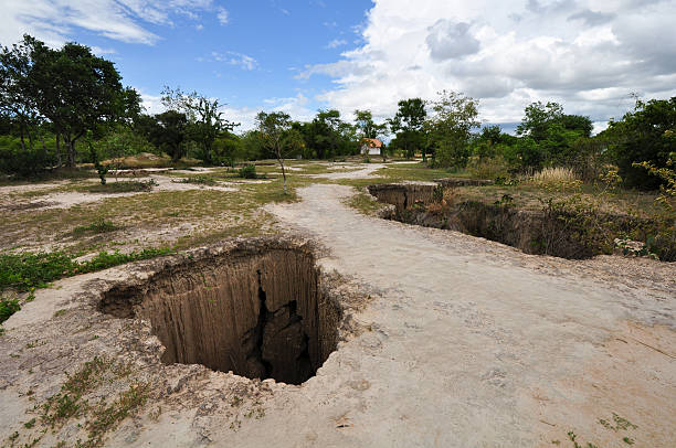 deep hole in the ground stock photo