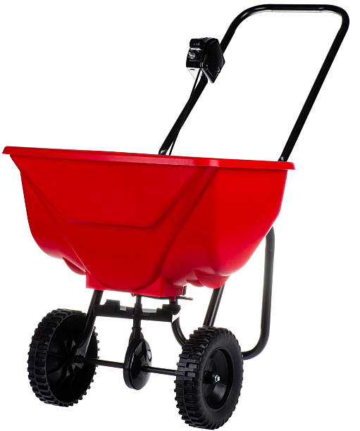 spreader for home and garden spreader for fertilizer, seed and road salt lawn seeder stock pictures, royalty-free photos & images