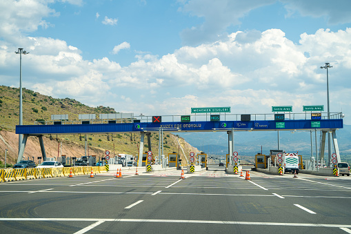 North Aegean Highway toll booths. Otoyol 33 or North Aegean Motorway (Kuzey Ege Otoyolu) and abbreviated as the O-33 is a 55.2 km long toll motorway in western Turkey. Izmir, Turkey - July 23, 2023.