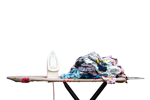 Top view of clothes stacked for ironing on a white isolated background