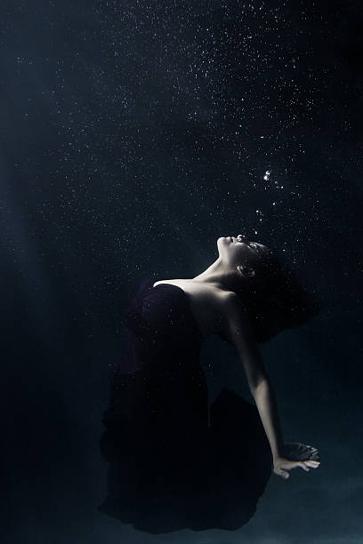 istock Young Woman Deep Underwater Wearing a Dress 157033286
