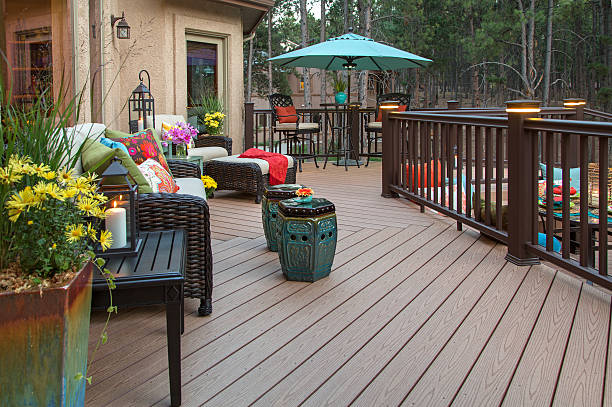 Beautiful Deck Beautiful backyard deck with built-in lighting and fully decorated with vibrant and colorful furniture and decor railing photos stock pictures, royalty-free photos & images