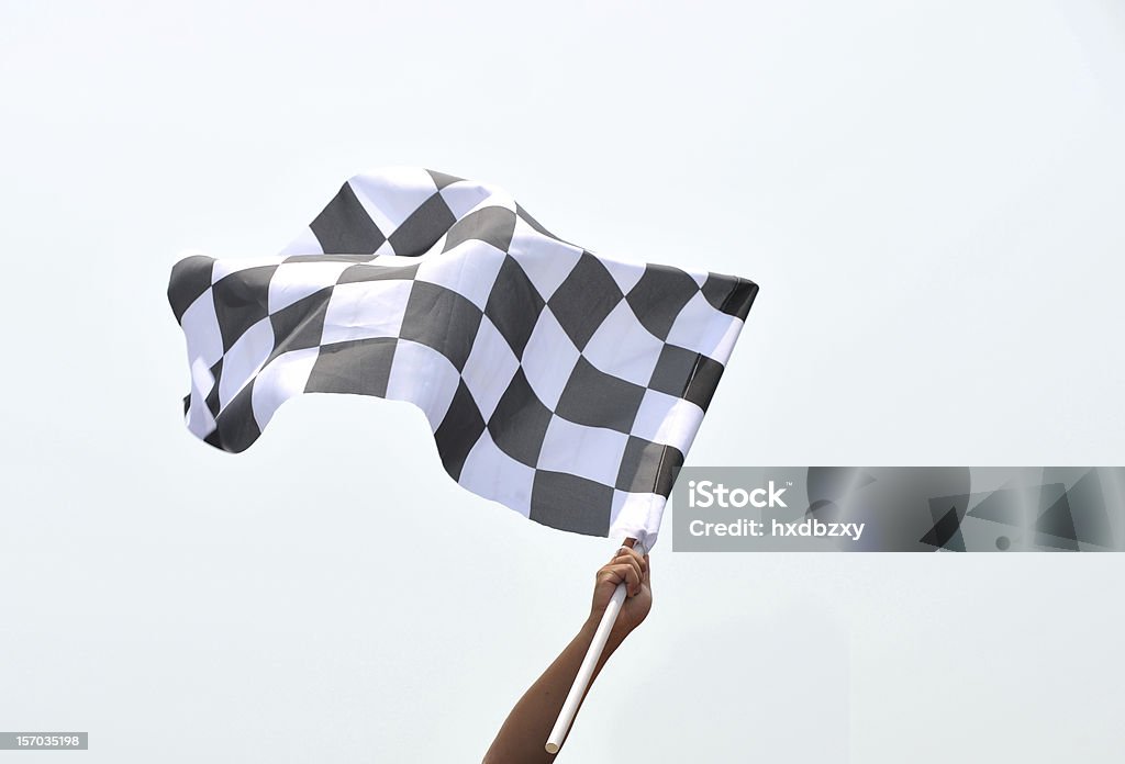 checkered racing flag checkered race flag in hand. Checkered Flag Stock Photo