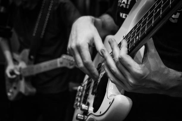 istock Person playing rock. Musical instrument 1570372014