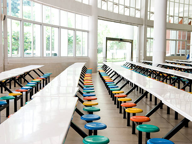 school cafeteria Clean school cafeteria with many empty seats and tables. cafeteria stock pictures, royalty-free photos & images