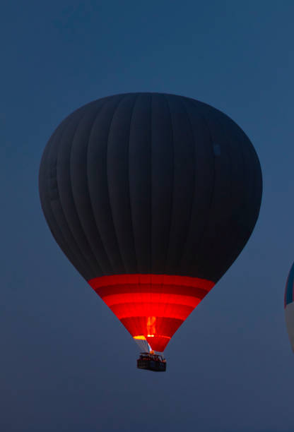 Cappadocia landscape with balloons and clouds at sunrise