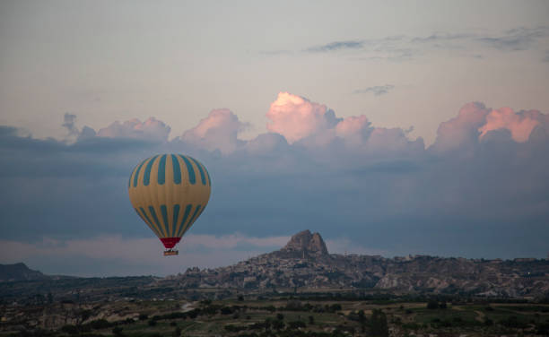 istock Cappadocia landscape with balloons and clouds 1570413892