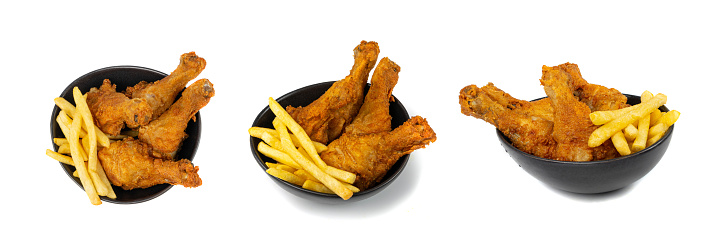 Chicken Legs Portion Isolated, Fry Breaded Drumstick, Deep Fried Chicken Drumsticks with French Fries in Black Bowl on White Background Top View